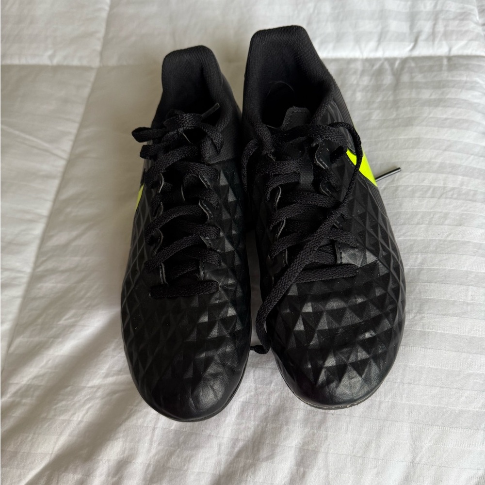 Black and Yellow Nike Tiempo soccer cleats